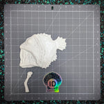 White fish-shaped object on a grid cutting mat with ID Fabrications logo.