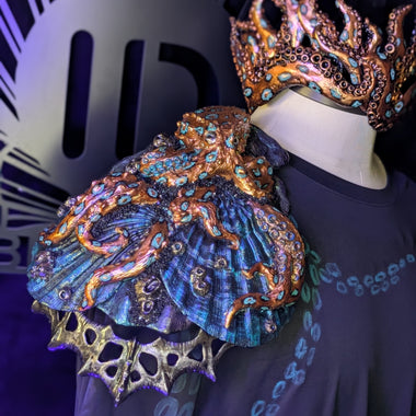 Decorative headpiece with intricate designs on a dark background