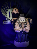 Mannequin wearing a decorative outfit with a matching mask on a dark background, branded 'ID FABRICATIONS'.