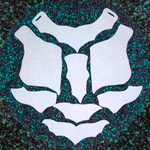 White protective pads on a textured green and black surface